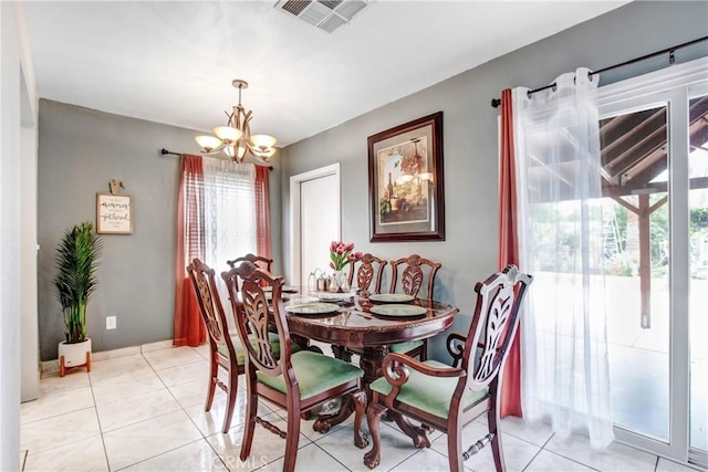 10005 Elwood Ave, Fontana, CA 92335 - dining area featuring light tile patterned floors, a chandelier, and visible vents
