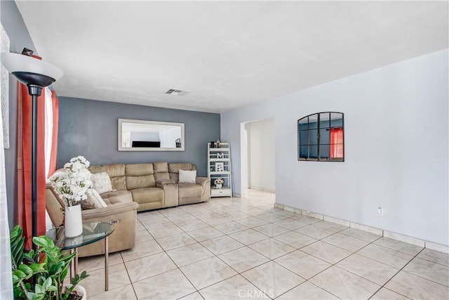 10005 Elwood Ave, Fontana, CA 92335 - living area featuring light tile patterned floors and visible vents