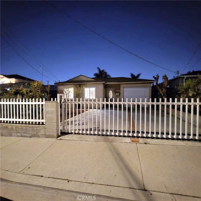 22724 Kinard Ave, Carson, CA 90745 - view of front of house featuring an attached garage and a fenced front yard