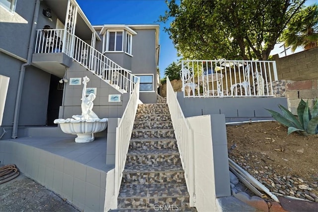 1745 College View Pl, Los Angeles, CA 90041 - view of side of home with stucco siding and stairway