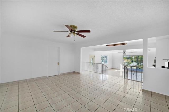 1745 College View Pl, Los Angeles, CA 90041 - spare room with a textured ceiling, ceiling fan, and light tile patterned floors