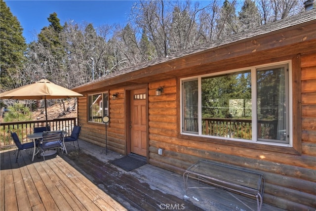 wooden deck featuring outdoor dining space