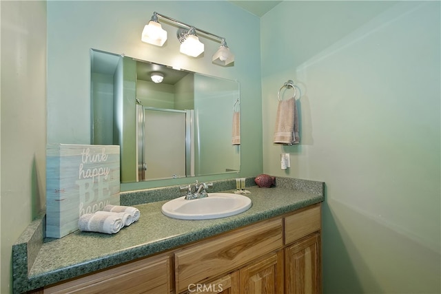 bathroom featuring vanity and a stall shower