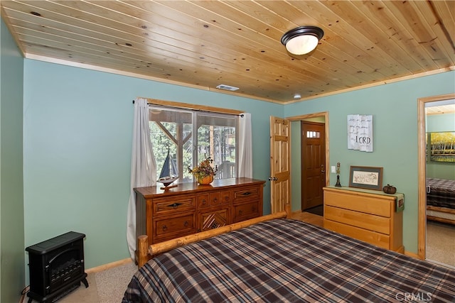 carpeted bedroom with wood ceiling, baseboards, and a wood stove