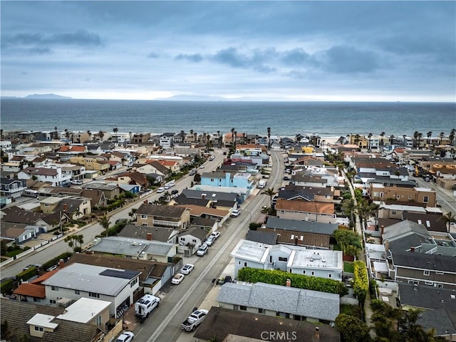 bird's eye view featuring a water view and a residential view