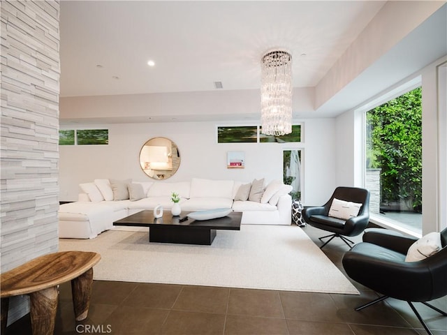 living area with a chandelier, dark tile patterned flooring, visible vents, and recessed lighting