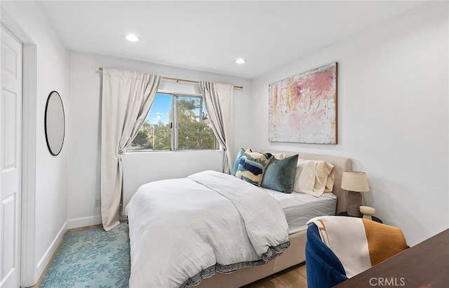 bedroom with baseboards and recessed lighting
