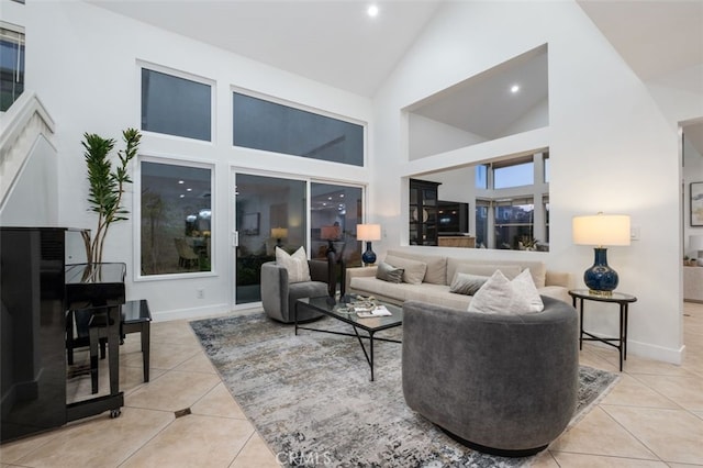 tiled living area featuring high vaulted ceiling, baseboards, and recessed lighting