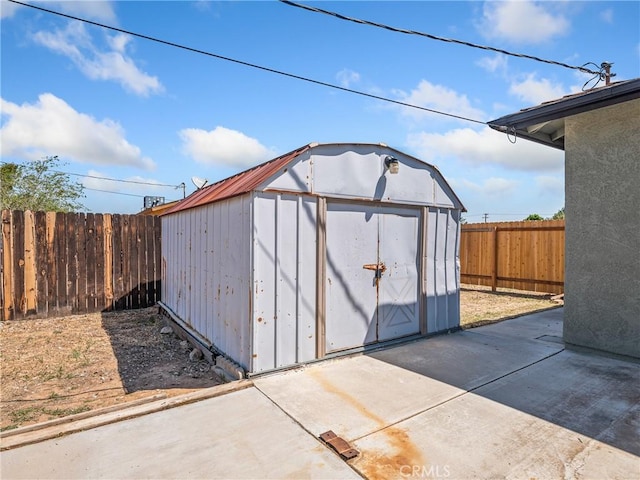 view of shed featuring a fenced backyard