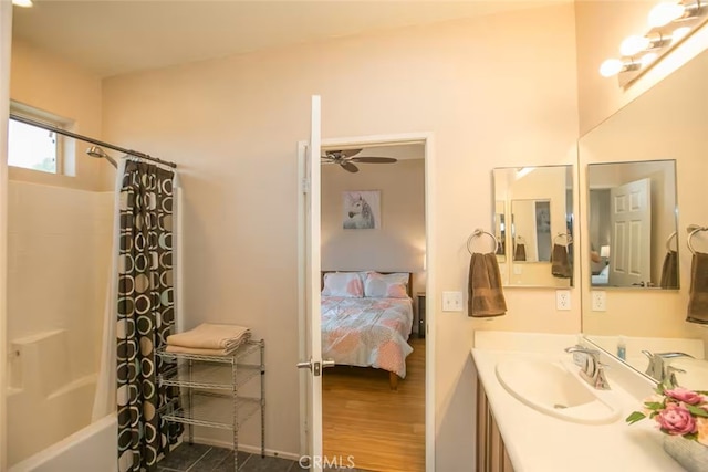 full bathroom featuring ensuite bathroom, a ceiling fan, shower / tub combo, and vanity