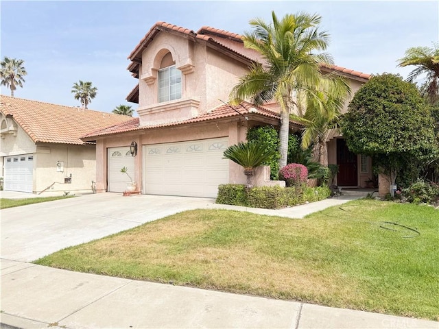 view of front facade featuring an attached garage, a front lawn, stucco siding, a tiled roof, and driveway
