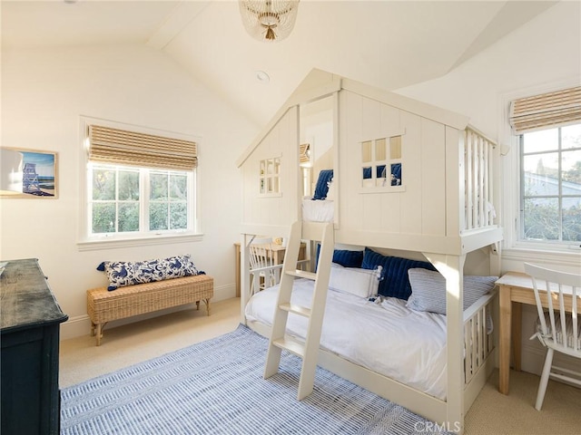 carpeted bedroom featuring vaulted ceiling
