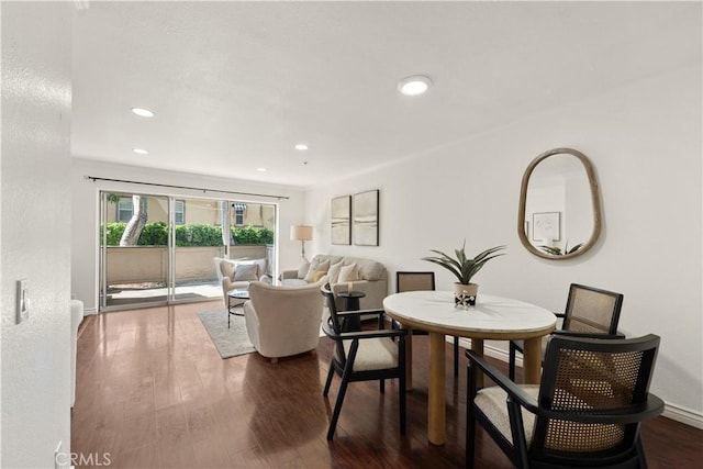 dining area featuring baseboards, recessed lighting, and dark wood-type flooring