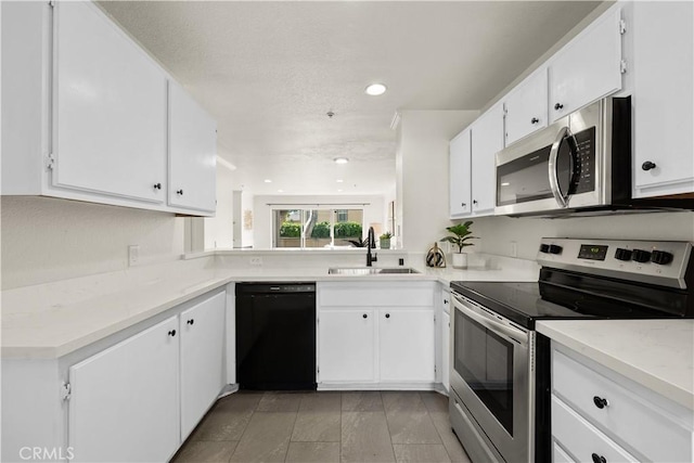 12584 Atwood Ct Unit 1215, Rancho Cucamonga, CA 91739 - kitchen with stainless steel appliances, a sink, white cabinetry, and recessed lighting