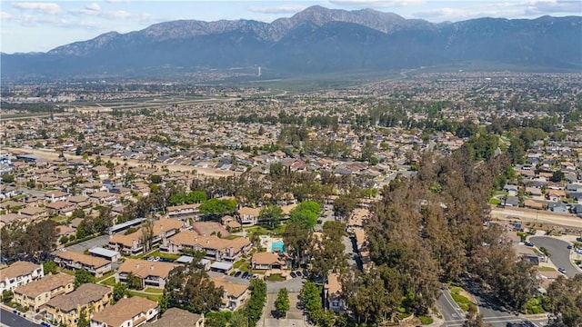 drone / aerial view featuring a residential view and a mountain view