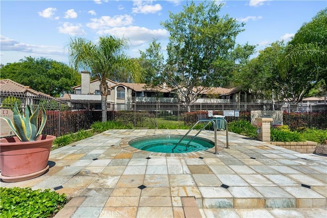 view of pool featuring a patio, a hot tub, and fence