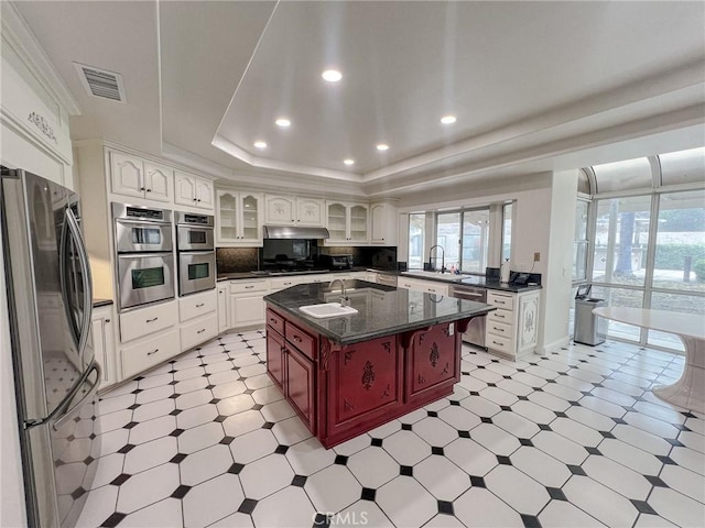 6926 Orozco Dr, Riverside, CA 92506 - kitchen featuring visible vents, a sink, light floors, and appliances with stainless steel finishes