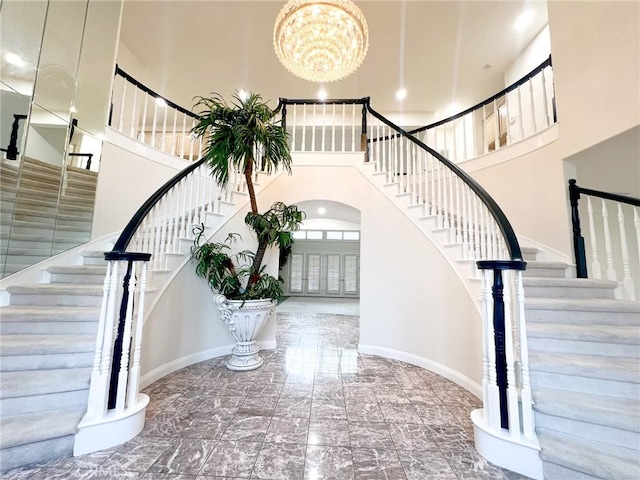 6926 Orozco Dr, Riverside, CA 92506 - foyer featuring a high ceiling, stairs, a chandelier, and marble finish floor