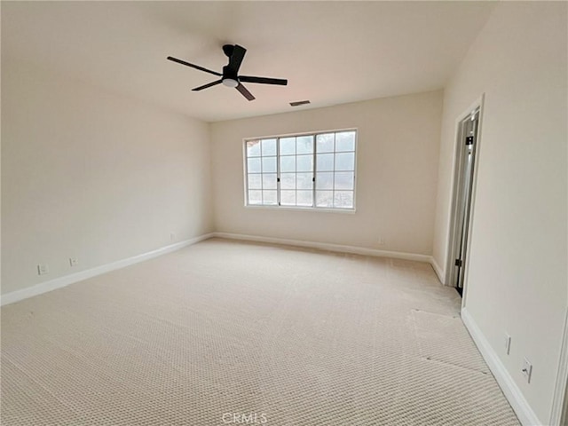 6926 Orozco Dr, Riverside, CA 92506 - unfurnished room featuring light colored carpet, baseboards, ceiling fan, and visible vents