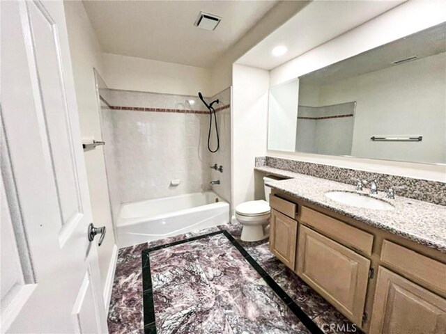6926 Orozco Dr, Riverside, CA 92506 - full bath featuring visible vents, vanity, toilet,  shower combination, and marble finish floor