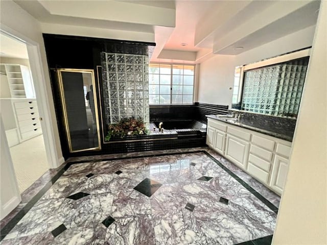 6926 Orozco Dr, Riverside, CA 92506 - bathroom with vanity, a shower stall, a bath, and marble finish floor