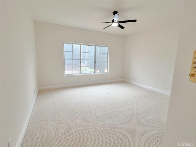 6926 Orozco Dr, Riverside, CA 92506 - spare room with baseboards, light carpet, and a ceiling fan
