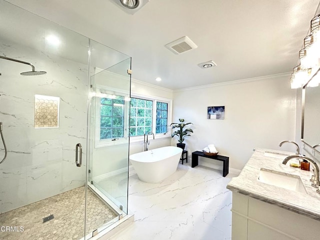 bathroom with a sink, a marble finish shower, a freestanding tub, visible vents, and ornamental molding