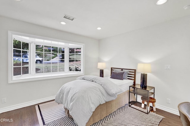 bedroom featuring recessed lighting, baseboards, visible vents, and wood finished floors