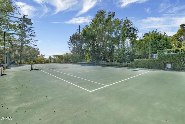 view of sport court with fence