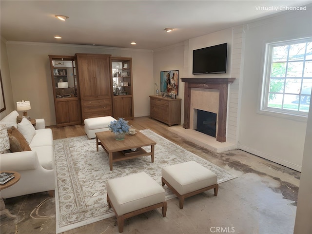 13511 Epping Way, Tustin, CA 92780 - living room featuring crown molding, a fireplace with raised hearth, and recessed lighting