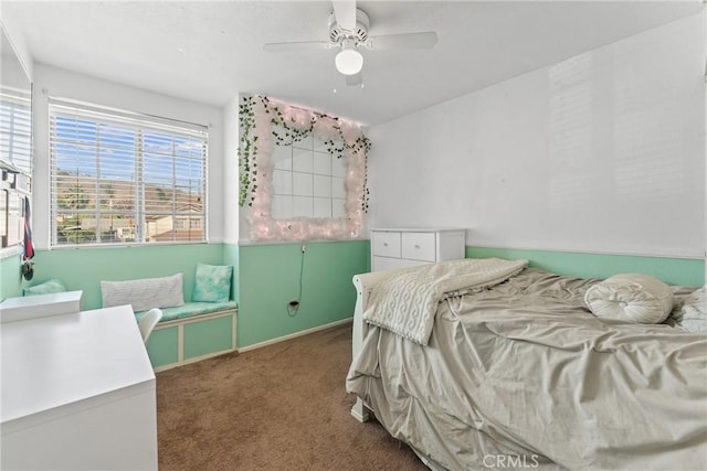 bedroom with a ceiling fan, baseboards, and carpet