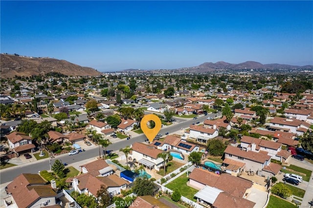 drone / aerial view featuring a residential view and a mountain view