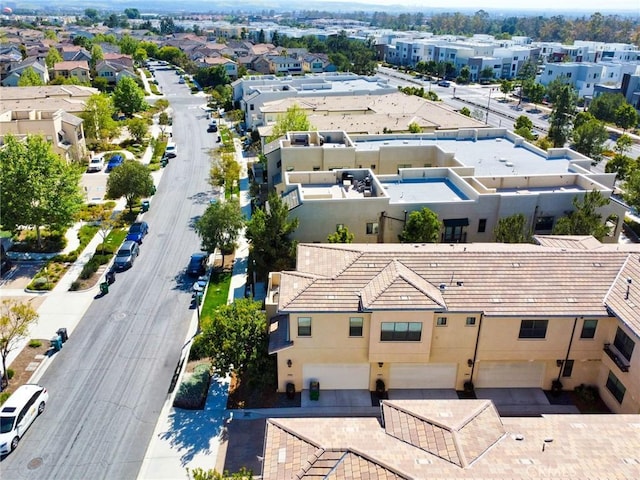 birds eye view of property with a residential view
