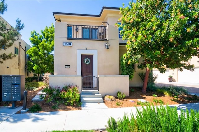 mediterranean / spanish-style home with stucco siding and a balcony