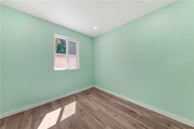 3882 Dwiggins St, Los Angeles, CA 90063 - unfurnished room with wood finished floors, baseboards, and recessed lighting