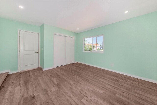 3882 Dwiggins St, Los Angeles, CA 90063 - unfurnished bedroom with wood finished floors, a closet, baseboards, and recessed lighting