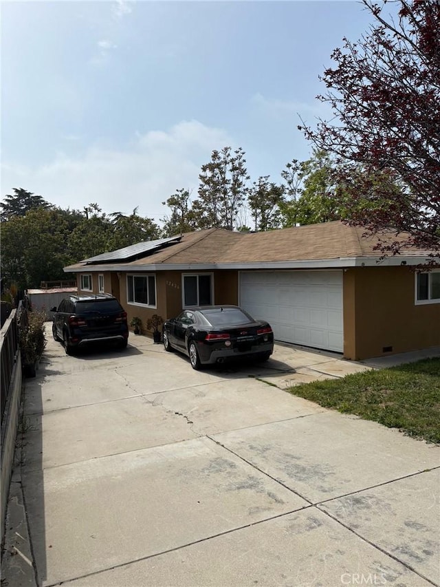 12426 2nd St, Yucaipa, CA 92399 - ranch-style home featuring a garage, fence, solar panels, and driveway