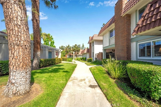 6572 Mcnutt Way, Cypress, CA 90630 - surrounding community with a yard and a residential view