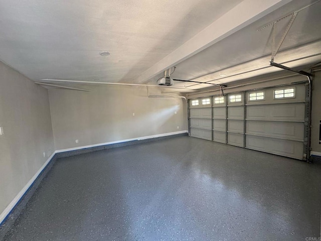 garage featuring baseboards and a garage door opener