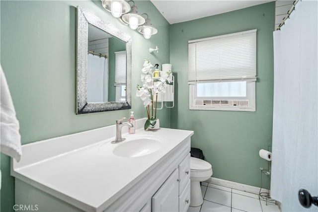 bathroom featuring tile patterned floors, vanity, and toilet