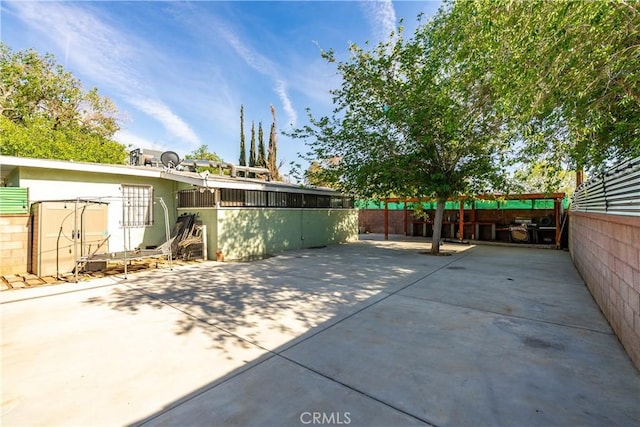 view of patio with fence