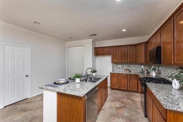 kitchen featuring visible vents, crown molding, light stone countertops, a sink, and black appliances