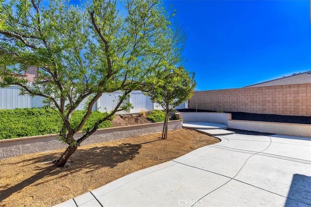 exterior space featuring a patio area and fence