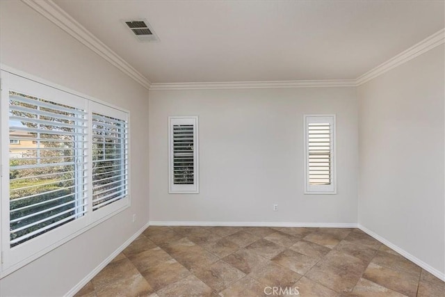 spare room featuring baseboards, stone finish flooring, ornamental molding, and visible vents
