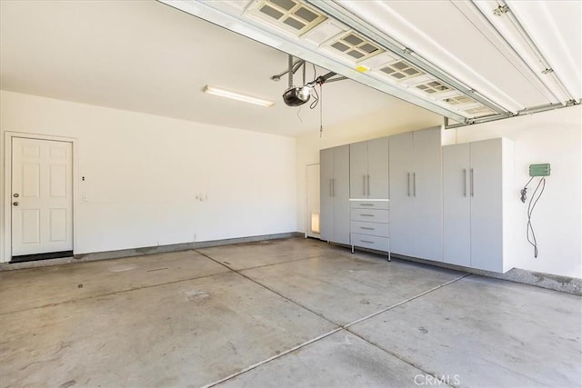 garage featuring a garage door opener