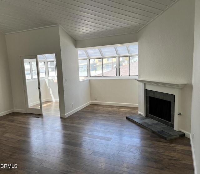 333 Highland Dr, Oxnard, CA 93035 - unfurnished living room with a tiled fireplace, dark wood-type flooring, and wooden ceiling