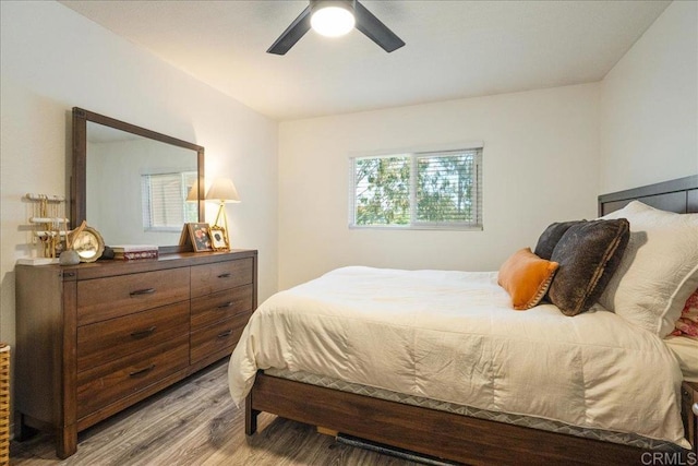 bedroom featuring a ceiling fan and wood finished floors