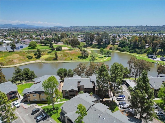 birds eye view of property with a water view and a residential view