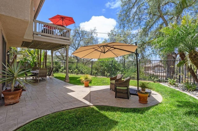 view of patio with outdoor dining area and a fenced backyard