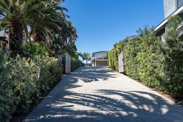 view of street featuring decorative driveway